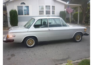 Illustration for article titled How To Stay Classy In A BMW 2002 Without Breaking The Bank